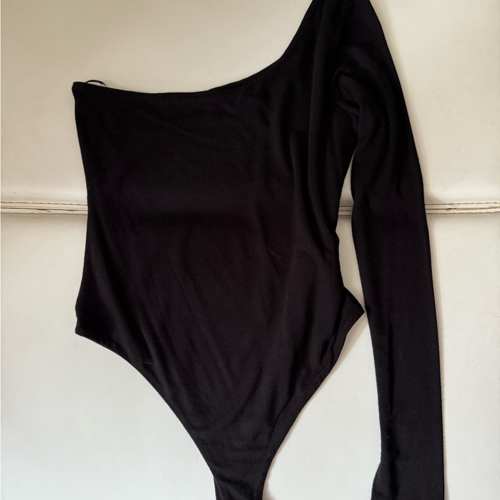 Naked Wardrobe One sleeve black body suit. Never worn.